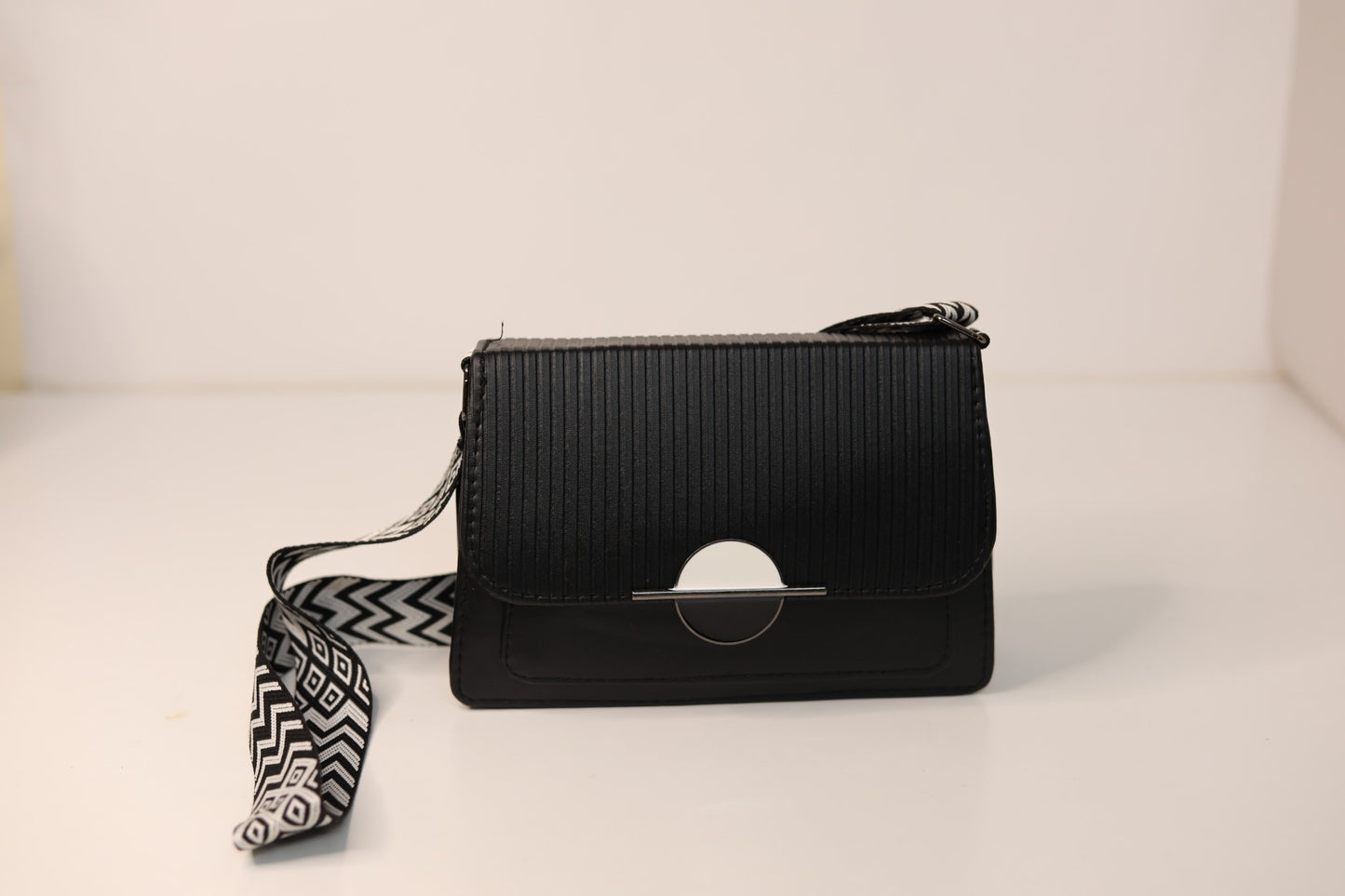 Black Crossbody Handbag with Geometric Strap
